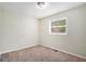 Spacious carpeted bedroom with a window and neutral walls at 2625 Abner Nw, Atlanta, GA 30318