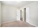 Well-lit bedroom with carpeted floor and a closet at 2625 Abner Nw, Atlanta, GA 30318