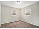 Cozy carpeted bedroom with neutral walls and two windows at 2625 Abner Nw, Atlanta, GA 30318