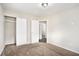 Carpeted bedroom with double door closet and access to another room at 2625 Abner Nw, Atlanta, GA 30318