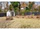 Fenced backyard with a storage shed and landscaping at 2167 Montrose Ave, Atlanta, GA 30311