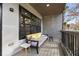 Outdoor balcony area with a couch and modern side table at 2167 Montrose Ave, Atlanta, GA 30311