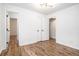 Bright, spacious bedroom with hardwood floors and multiple doorways at 6709 Londonderry Dr, Morrow, GA 30260