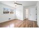 Bright bedroom with wood-look flooring, white walls, and ample natural light at 6709 Londonderry Dr, Morrow, GA 30260