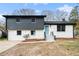 Front exterior of a two-story home with gray and white brick at 6709 Londonderry Dr, Morrow, GA 30260