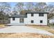Backyard with deck, patio, and white brick exterior at 6709 Londonderry Dr, Morrow, GA 30260