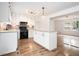 Updated kitchen with white cabinets, granite countertops, and stainless steel appliances at 6709 Londonderry Dr, Morrow, GA 30260