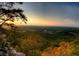 Scenic sunset view from a mountaintop overlooking a valley at 6969 Melody Dr, Buford, GA 30518