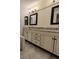 Elegant bathroom featuring granite countertops and double sinks at 820 Oakhaven Dr, Roswell, GA 30075