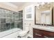 Updated bathroom with granite countertop and glass shower at 1472 Lachona Ct, Atlanta, GA 30329