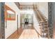 Two-story foyer with hardwood floors, elegant staircase, and mirror at 1472 Lachona Ct, Atlanta, GA 30329