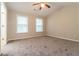 Spacious bedroom with neutral walls, ceiling fan, and plush carpeting at 2579 Willow Grove Rd # 8, Acworth, GA 30101