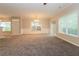 Bright living room with neutral walls, carpeting, and sliding glass doors at 2579 Willow Grove Rd # 8, Acworth, GA 30101