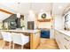 Modern kitchen featuring white cabinets, blue stove, wood accents, and an island at 3042 Farmington Se Dr, Atlanta, GA 30339