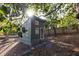 Small tiny house nestled amongst trees in the backyard at 3042 Farmington Se Dr, Atlanta, GA 30339