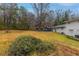 Large backyard with mature trees and a detached garage at 2761 Whisper Ct, Douglasville, GA 30135