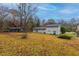 Spacious backyard with grassy area and mature trees at 2761 Whisper Ct, Douglasville, GA 30135