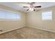 Bright bedroom featuring ceiling fan and carpet at 2761 Whisper Ct, Douglasville, GA 30135