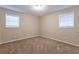 Well-lit bedroom with neutral walls and carpet flooring at 2761 Whisper Ct, Douglasville, GA 30135
