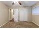 Well-lit bedroom with double door closet and carpet at 2761 Whisper Ct, Douglasville, GA 30135