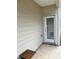 The back patio with a door and small table at 1323 Rosemary Ln, Atlanta, GA 30344
