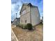 Side view of a two-story house with brick and siding at 1323 Rosemary Ln, Atlanta, GA 30344