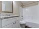 Simple bathroom with white fixtures, granite countertop, and shower/tub at 2755 Sherlock Dr, Decatur, GA 30034