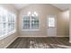 Dining area with wood-look flooring, vaulted ceiling, and plenty of natural light at 2755 Sherlock Dr, Decatur, GA 30034