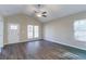 Cozy living room with wood-look flooring, large windows, and a ceiling fan at 2755 Sherlock Dr, Decatur, GA 30034