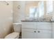 Clean bathroom featuring granite countertop and white cabinets at 2126 River Rd, Ellenwood, GA 30294