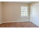 Bedroom with carpet, window, and closet at 2126 River Rd, Ellenwood, GA 30294