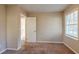 Bedroom with carpet, window, and access to bathroom at 2126 River Rd, Ellenwood, GA 30294