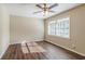 Bright bedroom with hardwood floors and ceiling fan at 2126 River Rd, Ellenwood, GA 30294