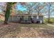 Back of house showing deck and backyard at 2126 River Rd, Ellenwood, GA 30294