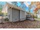 Gray brick house with wooden deck and fenced backyard at 2126 River Rd, Ellenwood, GA 30294