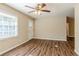 Spacious living area with hardwood floors and a ceiling fan at 2126 River Rd, Ellenwood, GA 30294