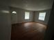 Empty living room with hardwood floors and neutral walls at 97 Harper Se Rd, Atlanta, GA 30315