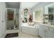 Bathroom with soaking tub, shower, and double vanity at 1142 Preserve Park Dr, Loganville, GA 30052
