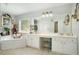 Bathroom boasts double vanity and a large soaking tub at 1142 Preserve Park Dr, Loganville, GA 30052
