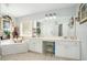 Elegant bathroom with double vanity and soaking tub at 1142 Preserve Park Dr, Loganville, GA 30052