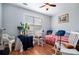 Cozy bedroom with a daybed, rocking chairs, and a small table at 1142 Preserve Park Dr, Loganville, GA 30052