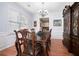 Formal dining room with hardwood floors and a large china cabinet at 1142 Preserve Park Dr, Loganville, GA 30052