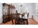 Formal dining room with hardwood floors and large windows at 1142 Preserve Park Dr, Loganville, GA 30052