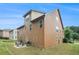 Tan house exterior with a patio and backyard at 1142 Preserve Park Dr, Loganville, GA 30052