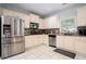 Kitchen with stainless steel appliances and granite countertops at 1142 Preserve Park Dr, Loganville, GA 30052