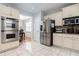 Kitchen with stainless steel appliances and light cabinets at 1142 Preserve Park Dr, Loganville, GA 30052