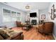 Spacious living room featuring hardwood floors and a fireplace at 1142 Preserve Park Dr, Loganville, GA 30052