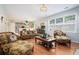 Open living space with hardwood floors and view into kitchen at 1142 Preserve Park Dr, Loganville, GA 30052