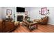 Living room with hardwood floors and a cozy fireplace at 1142 Preserve Park Dr, Loganville, GA 30052