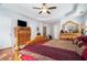 Spacious main bedroom with wood floors and a king-size bed at 1142 Preserve Park Dr, Loganville, GA 30052